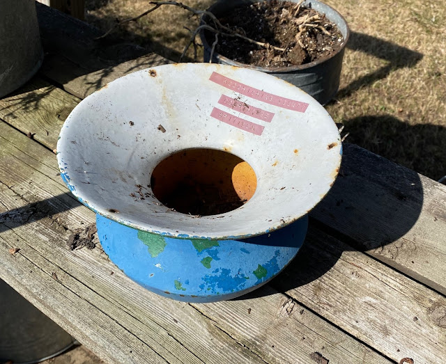Photo of an old painted cast iron spittoon.