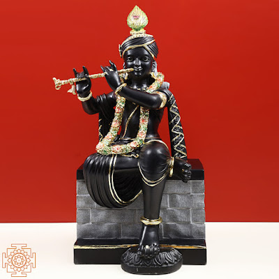 Fluting Krishna's Black Marble Statue