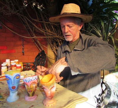 Andrew Carhartt woring at his art pieces in Pátzcuaro