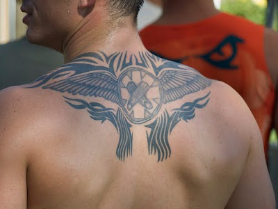 Upper back tattoos are hot! If you don't think so just imagine the wonderful