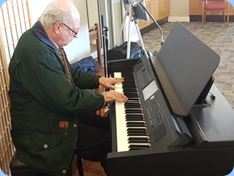 George Watt playing the Village's Yamaha Clavinova CVP-709