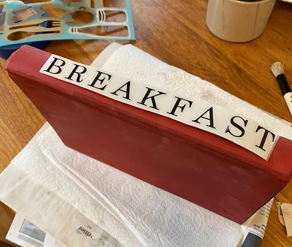 Photo of a Breakfast rub on transfer laying on book spine