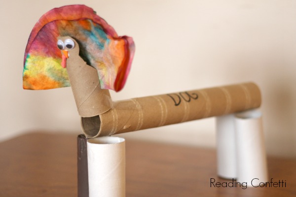 Thanksgiving turkey craft kids can make from a cardboard tube and coffee filter