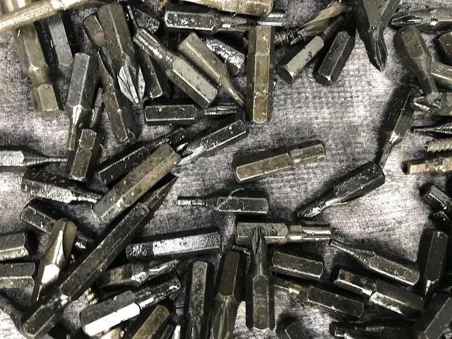 screws and drill bits after hydrochloric acid bath