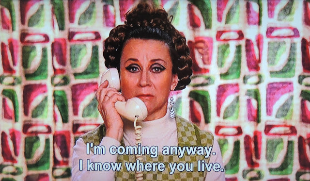 Almodovar's Lucia in vintage clothes with set hair