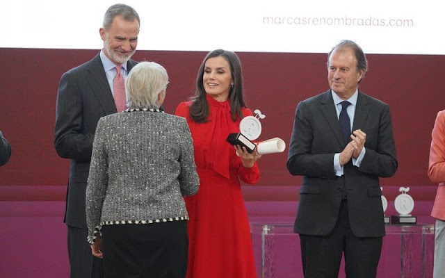 Queen Letizia wore a red silk pussy-bow blouse by Bimani and a red silk midi skirt of Spanish fashion brand Bimani