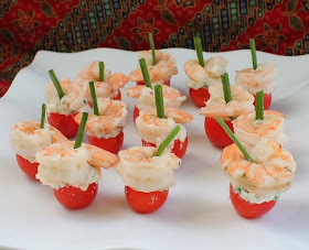 Food Lust People Love: Feta-Stuffed Cherry Tomatoes with Shrimp are exactly what they sound like: Cherry tomatoes filled with seasoned feta and topped with shrimp make one of the prettiest, easiest appetizers you can serve.