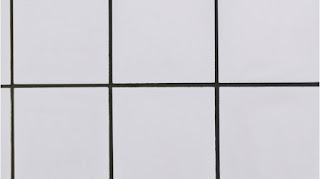 Azulejos blancos con lechada negra