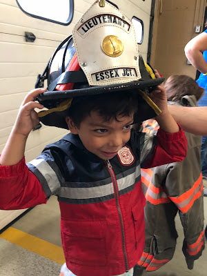 boy trying on a hat