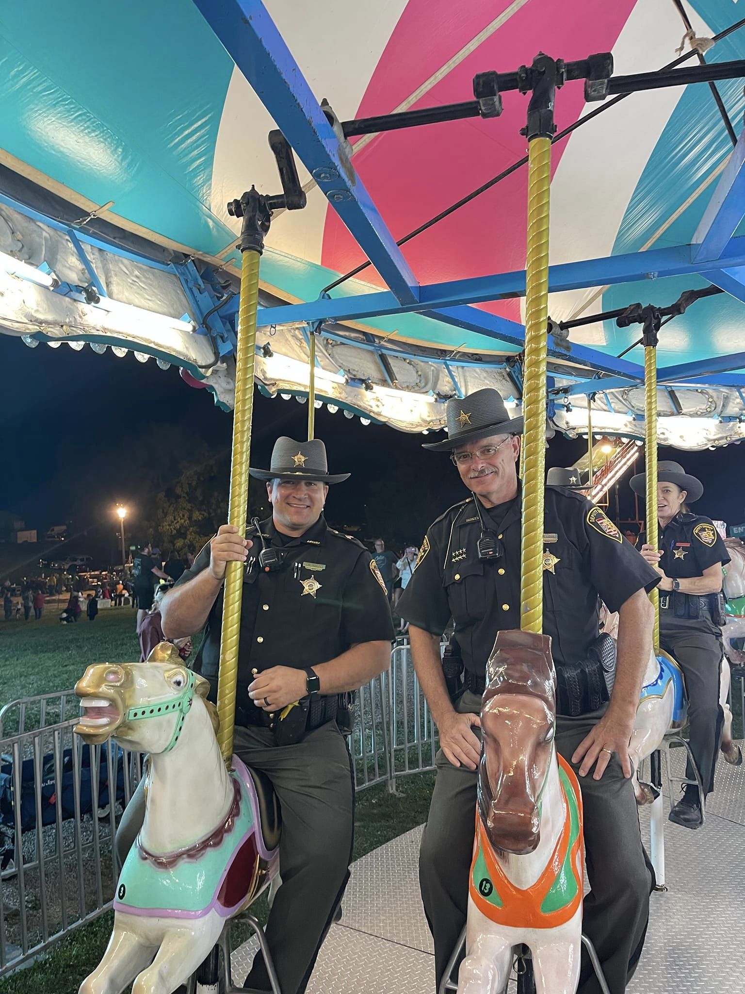 sheriffs on the horses on the merry go round
