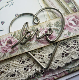 Metal heart embellishment from romantic vintage style wedding card with cute wedding couple
