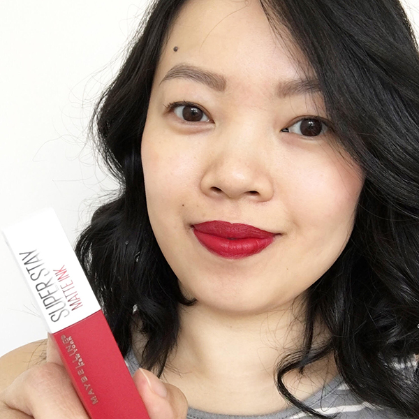 Vancouver-based beauty, life and style blogger Solo Lisa wears Maybelline Super Stay Matte Ink Liquid Lipstick in Pioneer, a classic cherry red