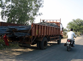 trucks carrying rods