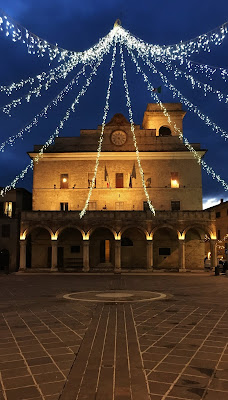 The regal main square of Montefalco Umbria Italy under a canopy of Christmas lights