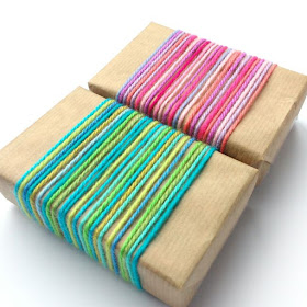 gifts wrapped with bright and colourful yarn scraps