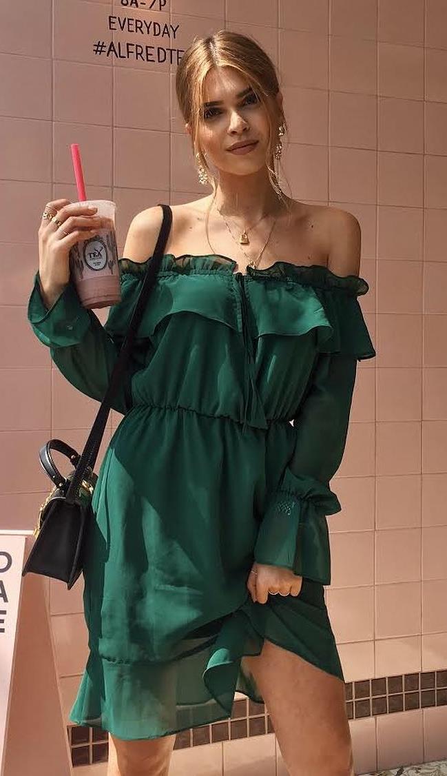 summer fashion trends | green off shoulder dress and black bag