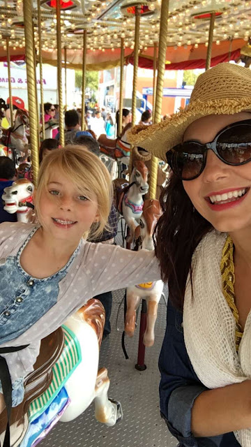 Mother and daughter enjoy a ride at the Houston Rodeo Carnival