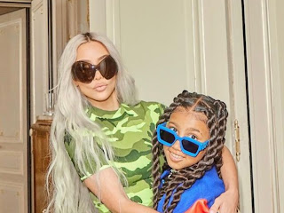 North West Looks Extra Cheerful Rocking Braids, A Vintage T-Shirt and Ripped Jeans With Mom Kim Kardashian: Photo