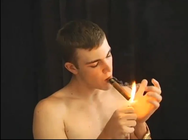 From the chest of a shirtless muscular guy lighting cigar