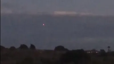 3 red lights flashing on a UFO that flew upwards over Camp Pendleton Military Base.