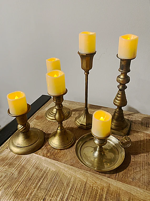 vintage brass candlesticks with votive lights
