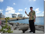 Edward with a Red Strip beer with ship in background.