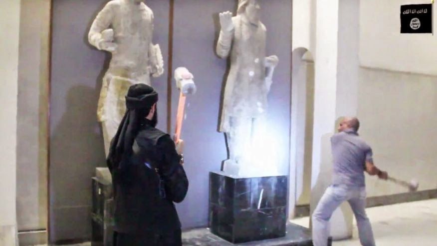 Islamic State smash ancient Iraq statues in Mosul