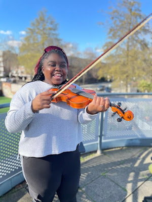 Kadina, one of the pupils at CCHS, proudly standing with her new violin. She is 16 and said: “I am really excited to learn the violin. I hope I don’t break it!”