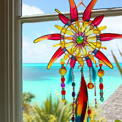 sun catcher in window with Bahamas sea in background