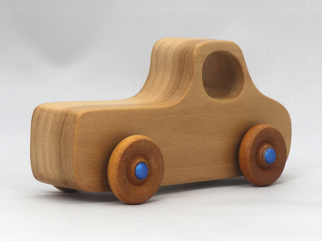 A Handmade Wood Toy Pickup Truck from the Play Pal Series Finished with Clear & Amber Shellac, Wax, and Metallic Blue Acrylic Paint