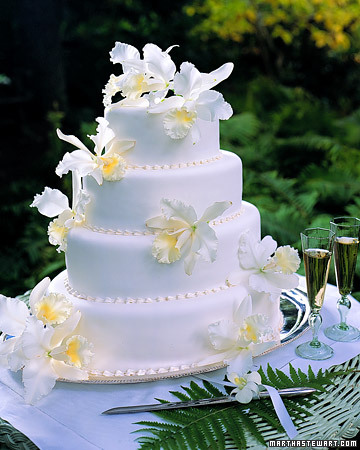 White Orchid Wedding Cake Voluptuous fresh cattleya orchids spill over a 