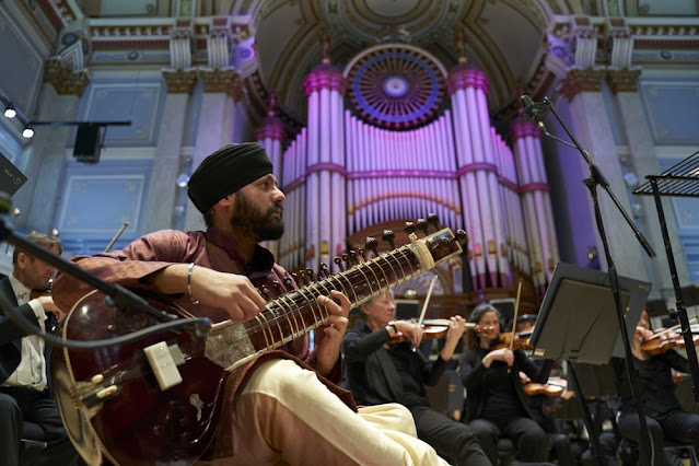 Jasdeep Singh Degun performing Arya: concerto for sitar and orchestra with Orchestra of Opera North (Photo Justin Slee)