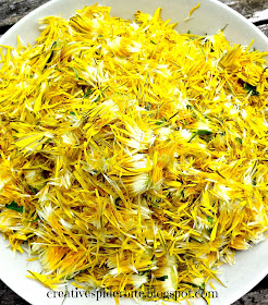 plate full of plucked dandelion flowers for dandelion syrup