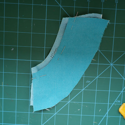 Flat felled jeans seam step 1. The top piece is off-set on top of the other, ready for sewing.
