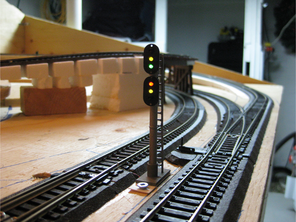 Dual trackside signal installed beside an Atlas turnout