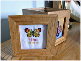 Photo cube with butterfly, name, and birthday cross stitched lid