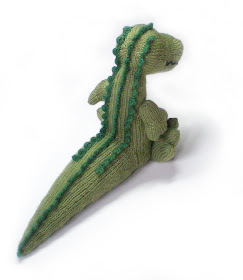 a knitted green cuddlesome crocodile called magda