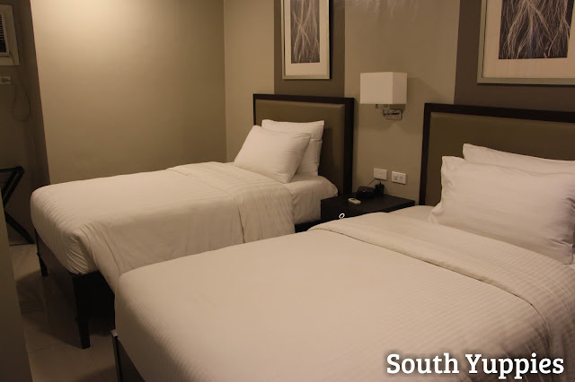 Twin beds in the second bedroom of the suite