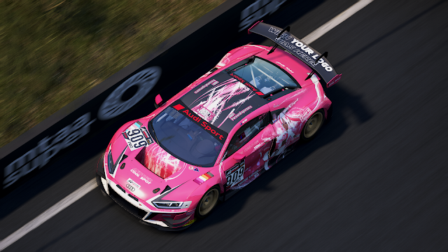 Picture from Assetto Corsa Competizione: an Audi R8 LMS evo II painted in the Queens' Design colours. It is pink with matte black and glossy white accents. On the sides is Victoire Laviolette, the team's mascot.