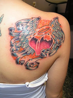 heart tattoo design on up backbody of girl