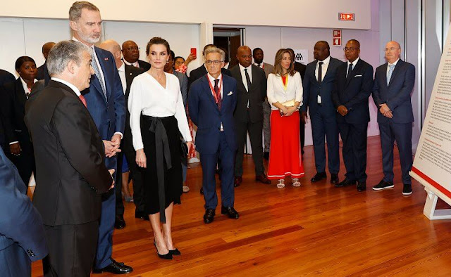 Queen Letizia wore white silk top and black skirt at the Epic Sana Hotel in Luanda for opening exhibition by Joan Miro