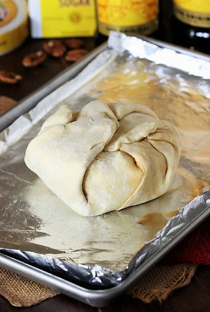 Brie Round Wrapped in Puff Pastry on Baking Sheet Image