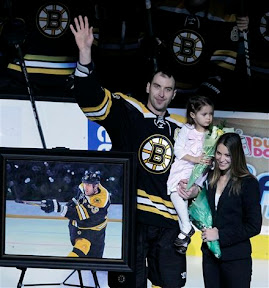 Zdeno Chara with his wife and daughter at a ceremony congratulating him for reaching 1000 NHL games