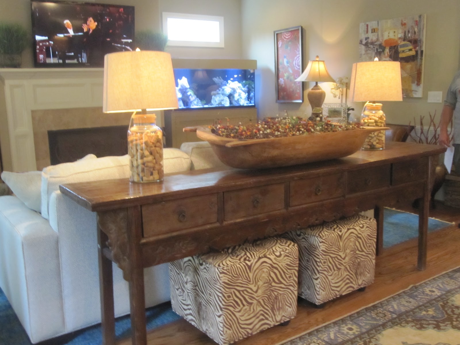 HomeArama Post I - I love this console table with the ottomans underneath! However, in real  life I thought it took up too much space because the family room area felt  a little ...
