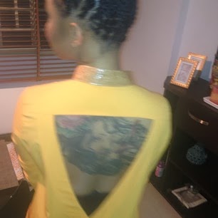 Tonto Dikeh Showing off her back tattoo