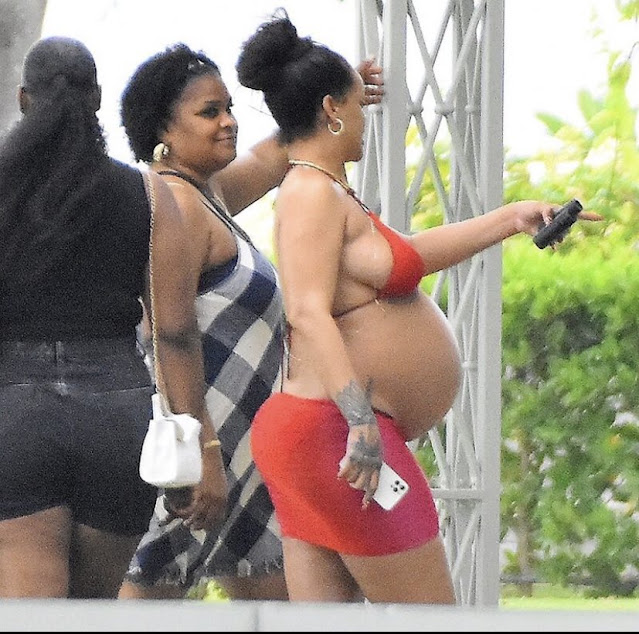 Pregnant Rihanna shows off her baby bump as she visits her hometown in Barbados (Photos)
