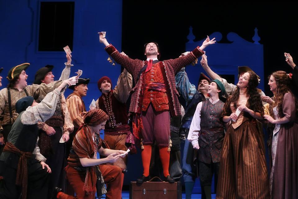 IN PERFORMANCE: Baritone TROY COOK as Figaro (center) in North Carolina Opera's production of Gioachino Rossini's IL BARBIERE DI SIVIGLIA, 1 April 2016 [Photo by Curtis Brown, © by North Carolina Opera]