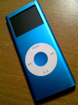 "Mystery iPod" © Laura Sheana Taylor, 2012. Metallic blue iPod. I scored this for five bucks at a garage sale. But what if its contents are worth way more?