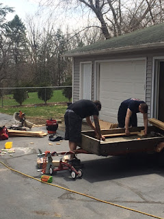 Firemen at work building garden boxes