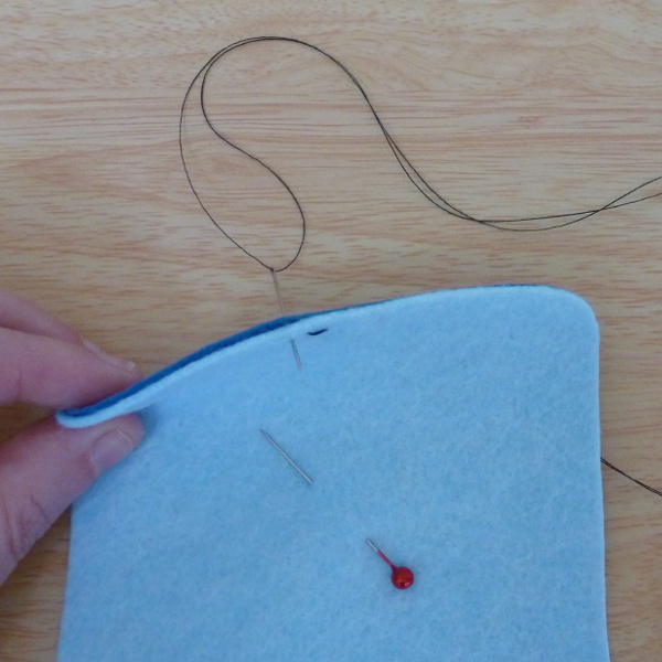 Making a second running stitch in the felt layers